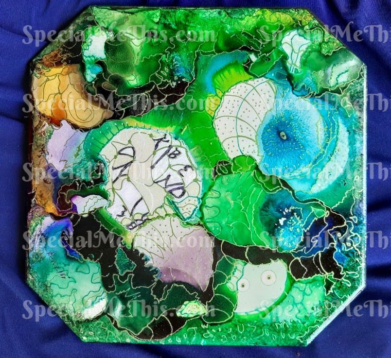 A green plate with some type of painting on it