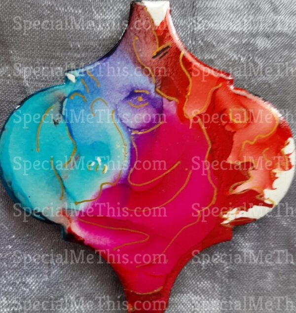 A colorful Arabesque Magnets with a red, blue, and yellow design.