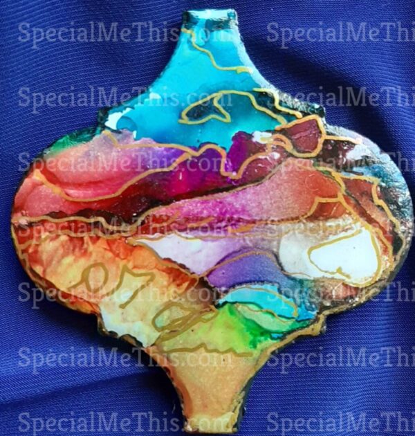 A colorful ornament with some type of painting on it.