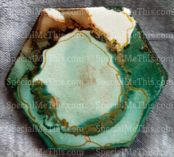 A green and gold agate tile on a grey background was replaced with Hexagonal Magnets.