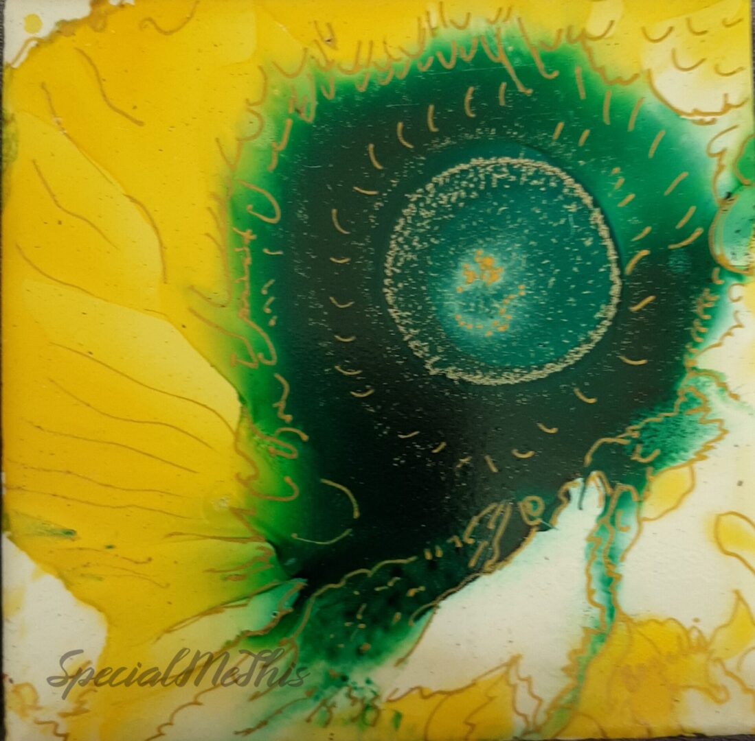 A yellow and green Glow tile with a flower on it.
