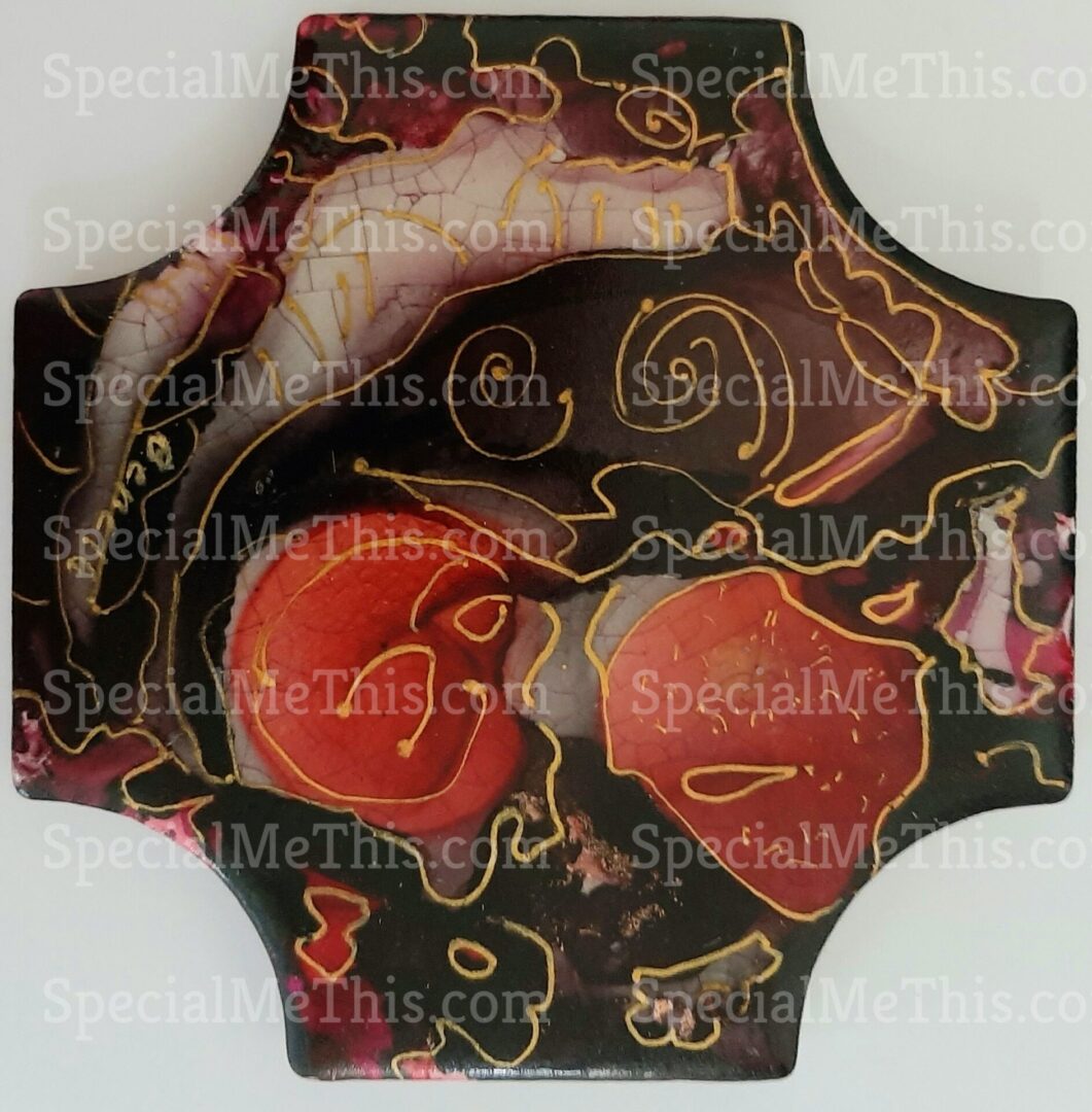 A black and red decorative plate with some shapes