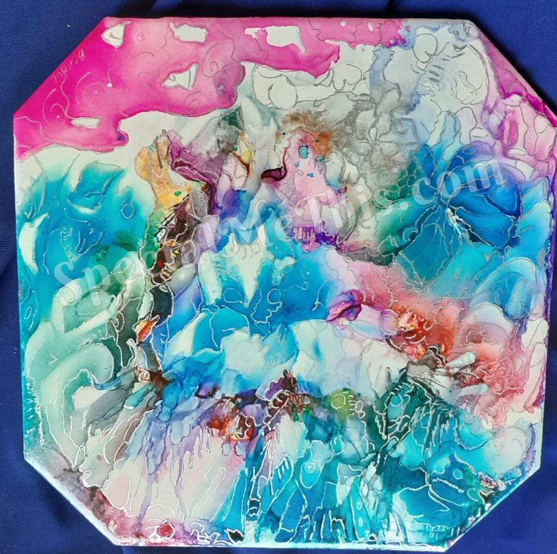 An Summer Fling shaped plate with blue and pink paint on it.