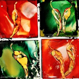 A set of four glass coasters with Red and Green Chili Peppers (Christmas) on them.