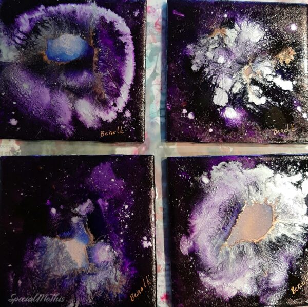 Four paintings of Purple Stars nebulas on a table.