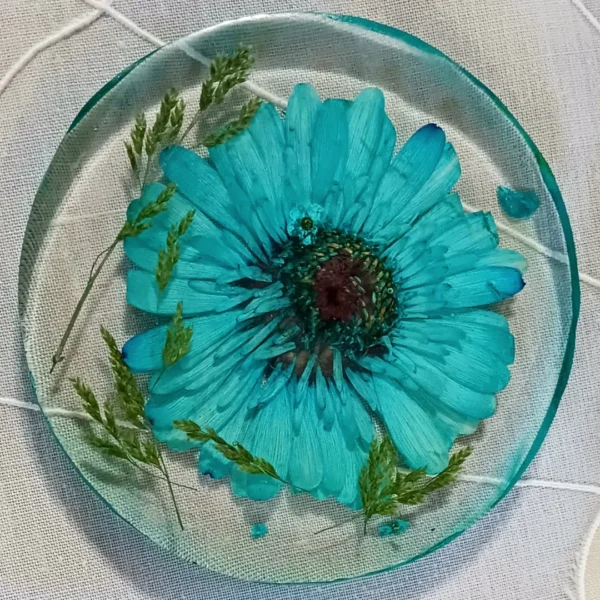 A Blue Color Flower In A White Resin Pour